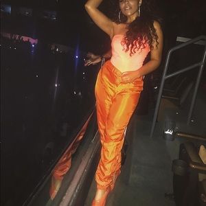 Orange track pants